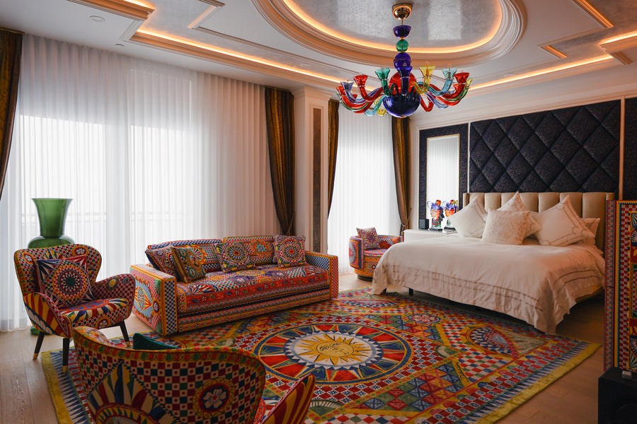 White sheers and darker curtain panels in a bedroom with a sitting area