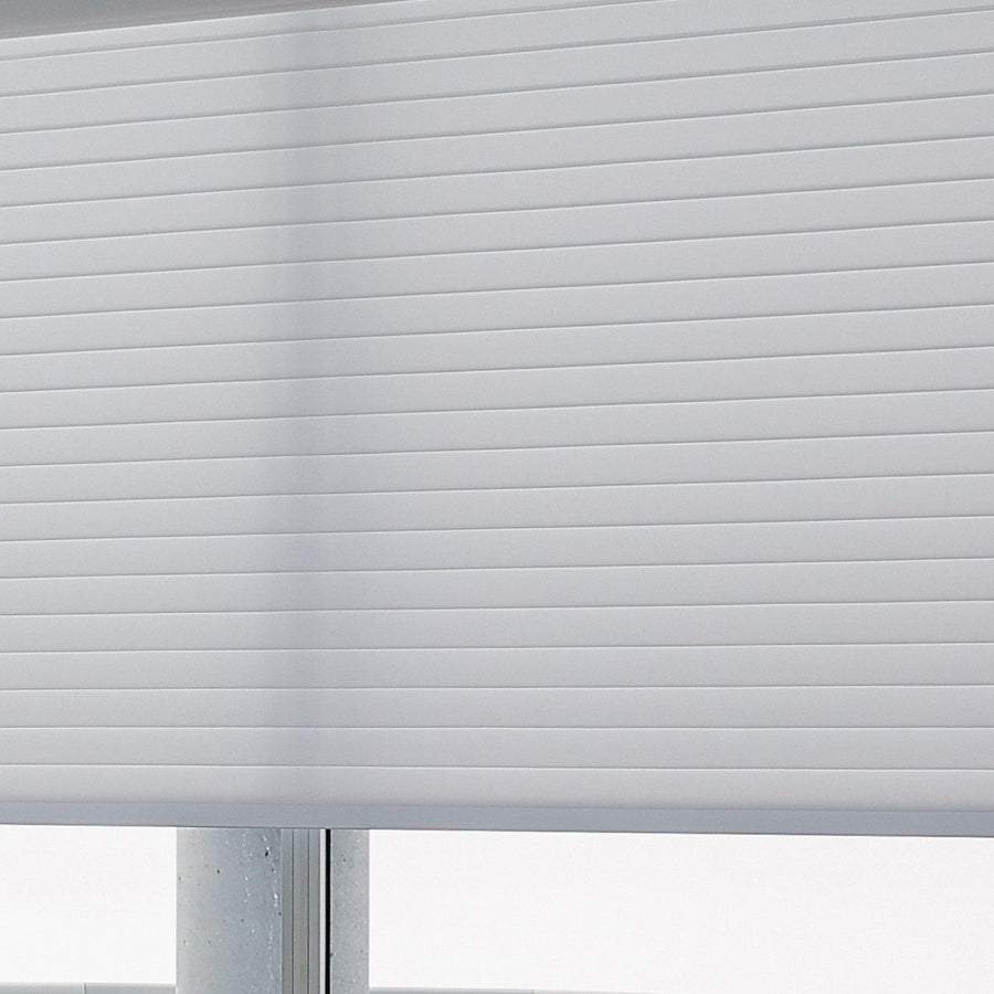 The same room close up, one shade sitting square to the window frame